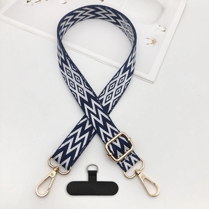 Adjustable woven phone lanyard with blue lightning pattern and gold metal hardware