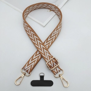 Close-up of durable woven phone strap in brown and white with golden adjustable metal buckle