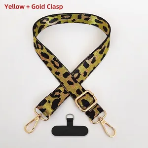 Adjustable leopard print phone lanyard with gold metal hook and black tether pad