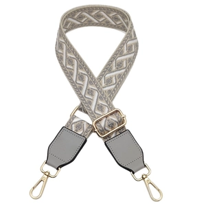 Adjustable grey and white geometric woven replacement shoulder strap with gold metal hooks