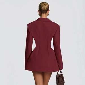Detail view of maroon blazer dress showing hourglass fit and flared hem from the back