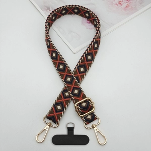 Detail of adjustable geometric diamond pattern phone strap with gold lobster clasps and pad