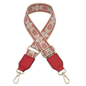 Adjustable wide ethnic style handbag strap with red floral weave and gold lobster clasps