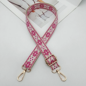 Pink and beige embroidered ethnic purse strap with gold hardware and adjustable buckle