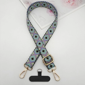 Detail view of woven rhombic pattern phone lanyard with gold metal buckle and strap
