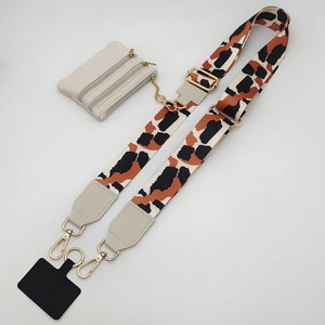 Adjustable leopard print strap with cream mini coin purse and gold metal hardware