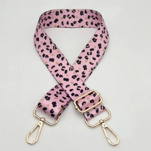 Wide pink leopard print bag strap with golden metal hooks and adjustable buckle