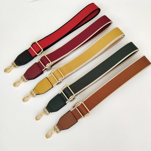 Detailed view of adjustable ethnic style wide woven bag straps in five assorted colors