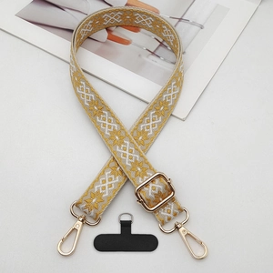 Detail of adjustable ethnic jacquard phone strap with gold metal hooks and connectors