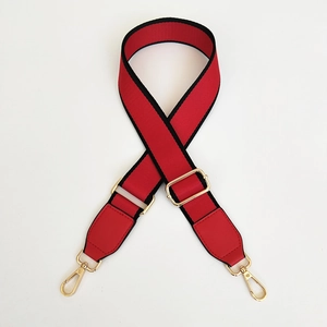 Adjustable red and black ethnic style crossbody bag strap with gold metal hardware