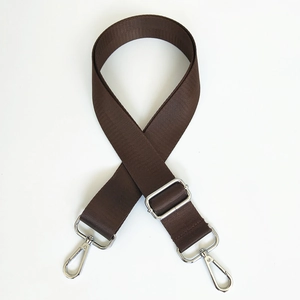 Close-up of dark brown nylon shoulder strap with silver metal swivel hooks and adjuster