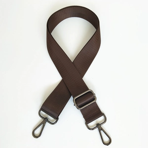 Detail of coffee brown adjustable nylon strap with dark grey metal snap hooks