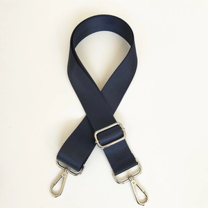 Close-up of durable navy blue nylon shoulder strap with silver rotating metal hooks
