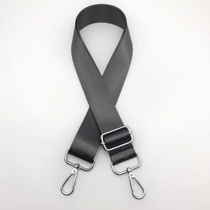Close-up of durable dark grey woven nylon strap with silver metal swivel hooks and adjuster