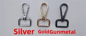 Close-up of swivel lobster clasps in silver, gold, and gunmetal finishes for bag straps