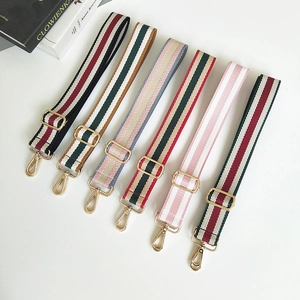 Detail showing six colorful striped bag straps with adjustable golden metal buckles