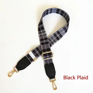 Adjustable wide replacement shoulder strap with black plaid pattern and gold metal clips