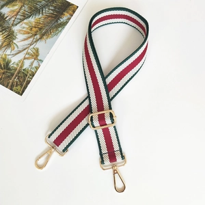 Adjustable canvas shoulder strap with classic red and green stripes and gold hardware