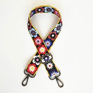 Detail of adjustable floral replacement strap with retro flower patterns and gunmetal hooks