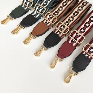 Detailed view of adjustable patterned bag straps with gold metal hooks in various colors