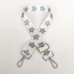 Detail view of floral replacement strap with silver swivel hooks and adjustable buckle