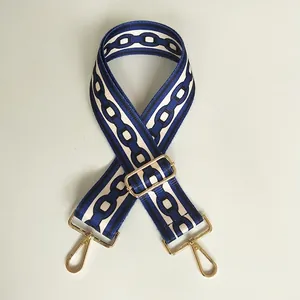 Adjustable wide ethnic shoulder strap with blue geometric chain pattern and gold hooks