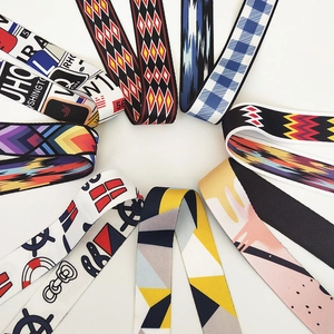 Close-up of adjustable ethnic style wide woven shoulder straps with geometric patterns