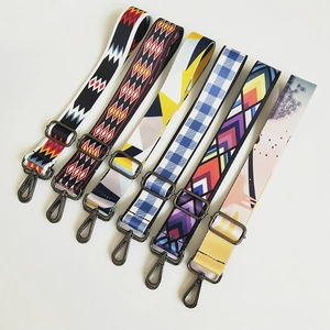 Detail showing six diverse ethnic style patterned woven straps with metal buckles