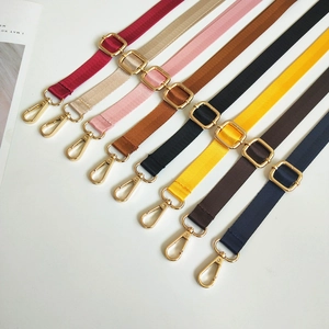 Detail view of 8 colored nylon straps with golden metal buckles and lobster clasps
