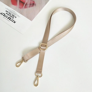 Champagne gold nylon shoulder strap with herringbone texture and metal swivel hooks