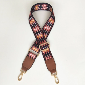 Adjustable colorful geometric shoulder strap with brown leather ends and gold metal clips