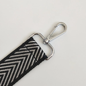 Detail of herringbone pattern strap with durable silver swivel lobster clasp hook
