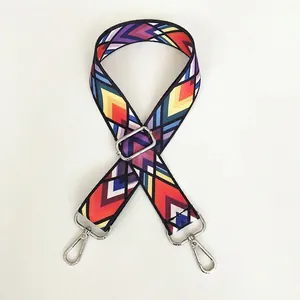 Macro shot of ethnic style guitar strap for crossbody bag with silver metal hooks