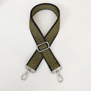 Detail view of adjustable black and yellow herringbone strap with silver metal swivel hooks