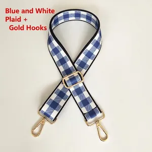 Detail of blue and white checkered adjustable woven strap with gold metal hooks