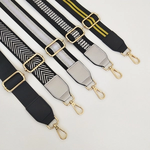 Various adjustable woven bag straps with gold hardware in assorted patterns and colors