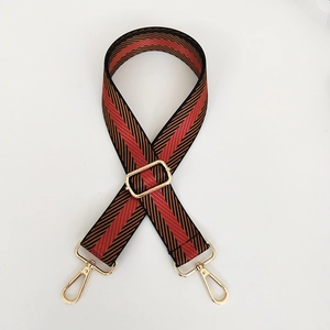 Adjustable wide woven herringbone purse strap with gold hardware and lobster clasps