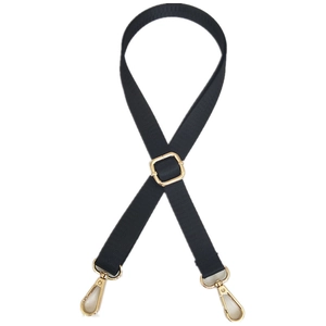 Adjustable black nylon shoulder strap with gold metal buckles for crossbody bags