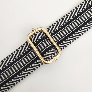 Close-up of adjustable wide shoulder strap with black and white geometric weaving