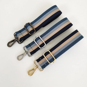 Three-color striped fabric bag straps with gunmetal, silver, and gold metal hardware