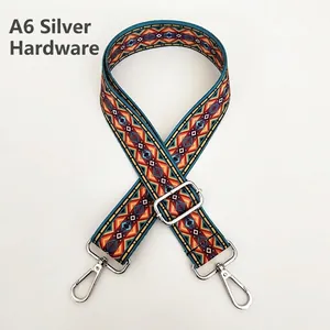 Close-up of ethnic geometric adjustable wide strap with silver hardware for handbags