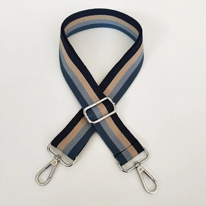 Detail of adjustable 3.8cm striped wide shoulder strap with silver metal hooks