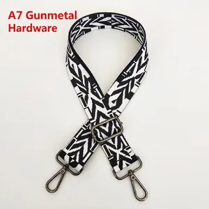 Detail of adjustable black and white geometric ethnic bag strap with gunmetal hardware