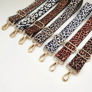 Detail of various leopard print wide replacement straps with adjustable gold metal buckles