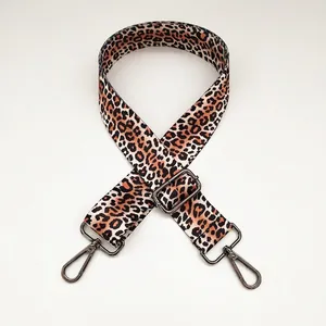 Detail of adjustable leopard print canvas bag strap with gunmetal swivel snap hooks