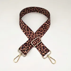 Adjustable leopard print bag strap with gold hooks and durable woven material