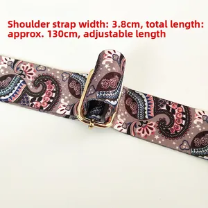 Detail of 3.8cm wide paisley strap with 130cm adjustable length and gold hardware