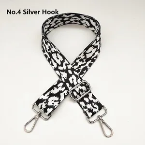 Adjustable leopard print bag strap with silver metal swivel hooks and wide webbing design
