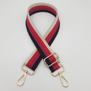 Detail of adjustable 3.8cm striped canvas bag strap with golden zinc alloy lobster clasps