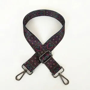 Detail view of ethnic bohemian embroidered purse strap with gunmetal swivel snap hooks